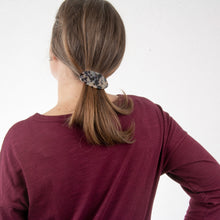 Load image into Gallery viewer, Lifestyle view of our Oval Blonde Tortoise Hair Barrette