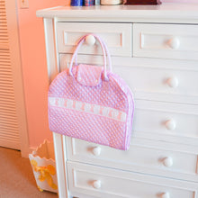 Load image into Gallery viewer, Lifestyle image of our Smocked Garment Bag