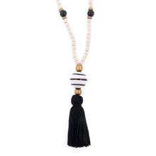 Load image into Gallery viewer, Natural wood bead necklace with black tassel featuring a large ceramic bead in the center