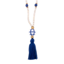 Load image into Gallery viewer, Natural wood bead necklace with navy tassel featuring a large ceramic bead in the center
