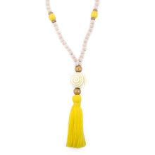 Load image into Gallery viewer, Natural wood bead necklace with yellow tassel featuring a large ceramic bead in the center