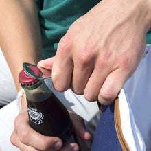 Load image into Gallery viewer, Bottle being opened with the bottle opener that comes with cooler bag
