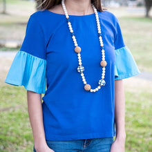 Load image into Gallery viewer, Lifestyle view of our Navy Cork Bead Necklace