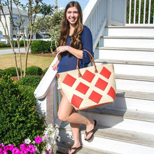 Load image into Gallery viewer, Model coming down steps with Red diamond tote
