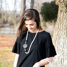 Load image into Gallery viewer, Lifestyle view of our Black Flat Bead Necklace