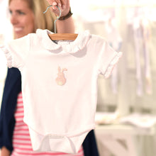 Load image into Gallery viewer, Lifestyle view of our Pink Bunny French Knot Onesie

