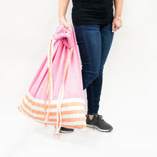 Load image into Gallery viewer, Lifestyle image of our Pink and Orange Color block Laundry Bag