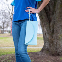 Load image into Gallery viewer, Lifestyle view of our Turquoise Lizard Foldover Clutch
