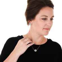 Load image into Gallery viewer, Lifestyle view of our Gray Pebble Grain Circle Earrings