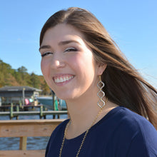 Load image into Gallery viewer, Lifestyle view of our Wrapped Quatrefoil Earrings