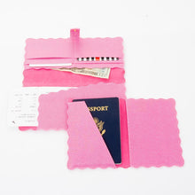 Load image into Gallery viewer, Lifestyle view of our Pink Lizard Scallop Passport Holder