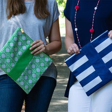 Load image into Gallery viewer, two models holding a green bamboo and blue stripe zipper pouch
