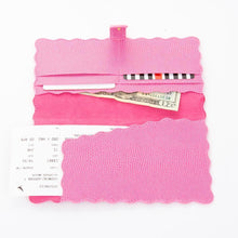 Load image into Gallery viewer, Lifestyle view of our Pink Lizard Scallop Travel Wallet