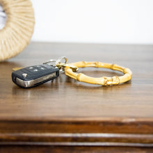 Load image into Gallery viewer, Lifestyle view of our Bamboo Round Keyring
