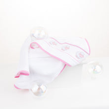 Load image into Gallery viewer, Lifestyle image of our Pink Lamb Smocked Hooded Towel
