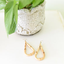 Load image into Gallery viewer, Lifestyle view of our Teardrop Bamboo Earrings
