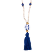 Load image into Gallery viewer, Natural wood bead necklace with navy tassel featuring a large ceramic bead in the center
