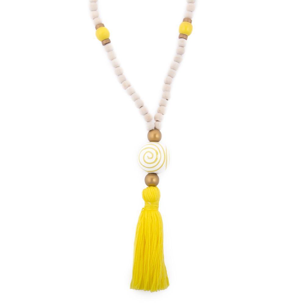 Natural wood bead necklace with yellow tassel featuring a large ceramic bead in the center
