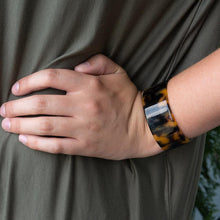 Load image into Gallery viewer, Tortoise Cuff Bracelet in Black and brown on a model 
