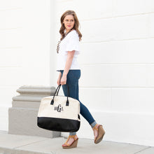 Load image into Gallery viewer, Lifestyle image of our Black Linen Duffle Bag
