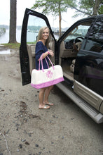 Load image into Gallery viewer, Model carrying a monogrammed pink gingham duffle bag

