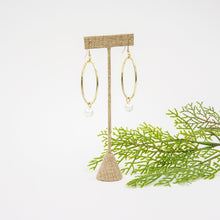 Load image into Gallery viewer, Lifestyle view of our Oval Dangle Pearl Earrings
