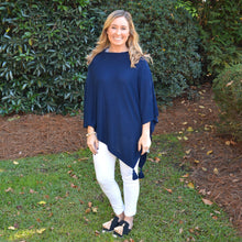 Load image into Gallery viewer, Lifestyle Image of our Navy Spring Tassel Poncho
