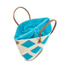Load image into Gallery viewer, Top view of turquoise diamond straw tote, showing the drawstring lining.
