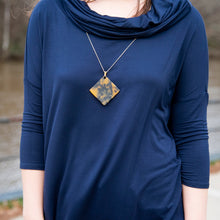 Load image into Gallery viewer, Lifestyle view of our Tortoise Square Disc Necklace
