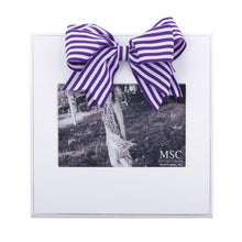 Load image into Gallery viewer, White frame with purple and white stripe bow at the top of the frame, holds 4 x 6
