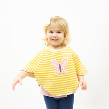 Load image into Gallery viewer, Lifestyle view of our Yellow Butterfly Toddler Poncho
