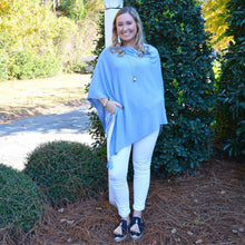 Load image into Gallery viewer, Model wearing a periwinkle spring poncho
